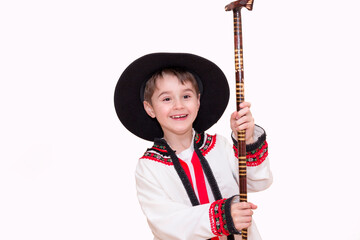 Boy age 6 boy  in costume of highlander. Funny faces.