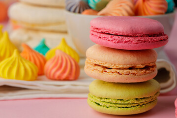 Obraz na płótnie Canvas Stack of colored macaroon cookies close up