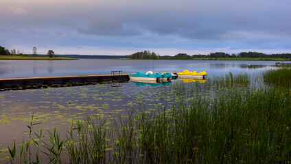 Catamarans at the pier. Boginskoe lake. Braslav lakes. National park. Vitebsk region. Belarus.