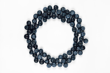 nature and healthy food concept - Top view of fresh blueberries isolated on white background. Copy space.