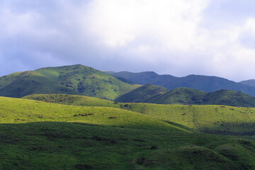 Fototapeta premium View of the gorge in the mountains. The village and the road. Summer landscape. Kyrgyzstan Issyk-ata gorge.