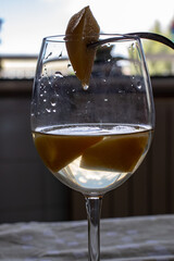 In the foreground a percoca bathed in wine.