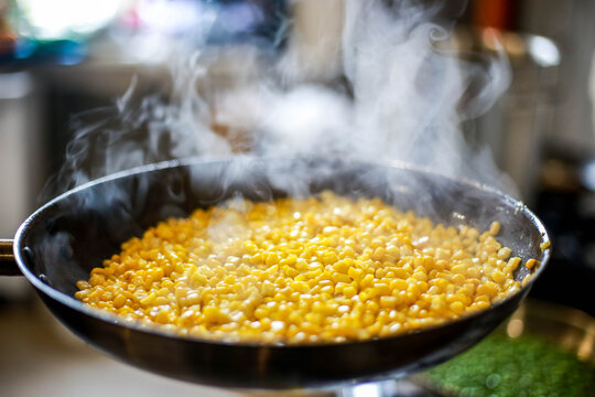 cooking corn in a pan