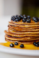 Pancakes with fresh blueberry and maple syrup
