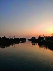  sun rising on the river