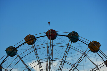 ferris wheel against blue sky