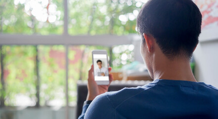 close up senior woman hand touching on handset telephone to calling to colleagues or answering...