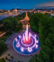 Budapest, Hungary - Aerial view of the Margaret Island Musical Fountain at dusk with Parliament building, Fisherman's Bastion and Buda Castle Royal Palace at background