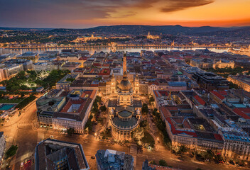 Budapest, Hungary - Aerial panoramic view of illuminated Budapest with a magnificent golden sunset. The view includes St.Stephen's Basilica, Szechenyi Chain Bridge and ferris wheel at Elisabeth Square