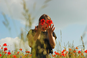 girl in poppy field