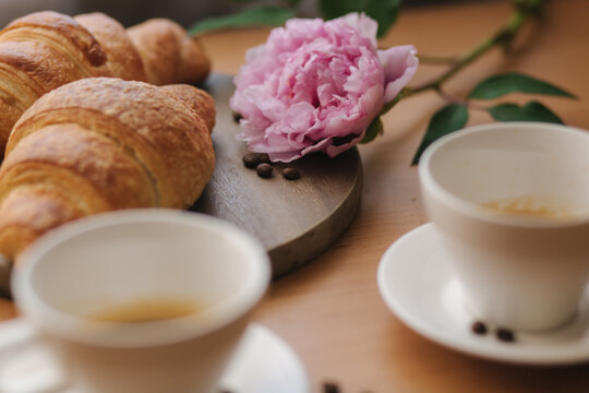 Vegan Breakfast At Home. Cappuccino With Coconut Milk And Two Empty Vegan Croissants. Morning With Coffe. Pink Peony Flower On Table