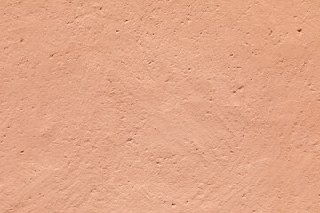 detail of old red plaster wall
