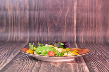 Tasty salad with grilled squid and avocado