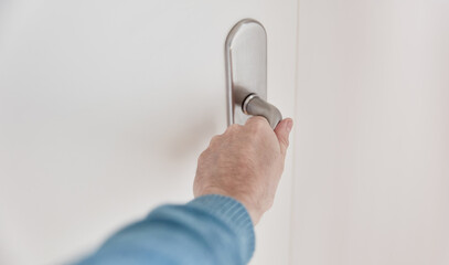Open the door by hand on the handle