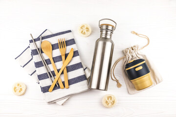 Eco set with bamboo cutlery, reusable coffee mug and water bottle.