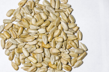 Pile of sunflower seeds without shell isolated on white background.