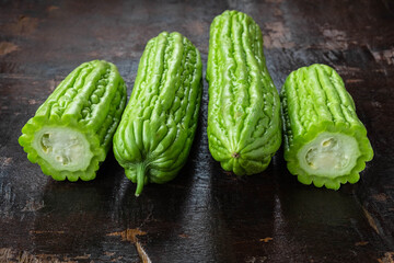 .Fresh bitter gourd on a wooden background