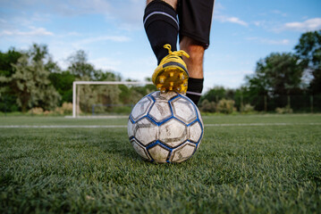 Close up of soccer player with ball on soccer field
