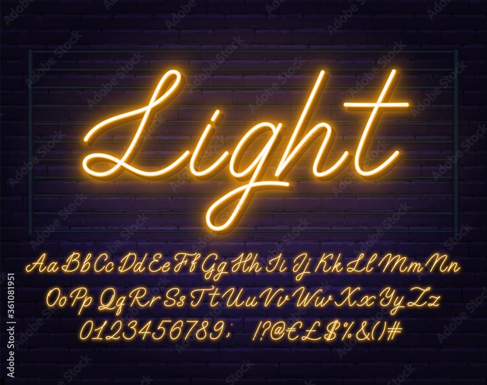 Fototapete neon yellow script font. glowing alphabet with letters, numbers and special characters on a brick ba