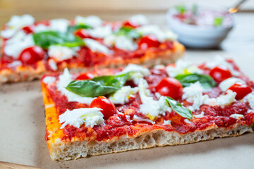 Pizza margarita with cherry tomato, basil and morzzarella cheese