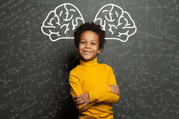 Smiling black child with big brain and science formulas on black, education and brainstorming...