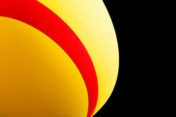 Yellow red paper on an isolated black background