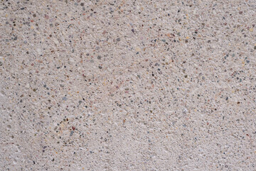 the texture of concrete is ivory with splashes of different colors