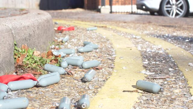 Nitrous Oxide Canisters Litter On Floor Drugs