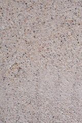 The texture of concrete is ivory with splashes of different colors