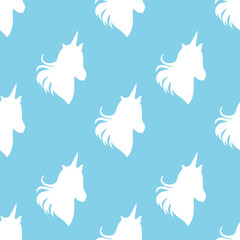 Seamless pattern unicorn head silhouette on blue background