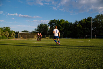Obraz premium Soccer player kicks the ball.Soccer player takes the free-kick.