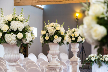 Flowers at a wedding reception, wedding venue, wedding bouquet, white roses, multi colour color flowers