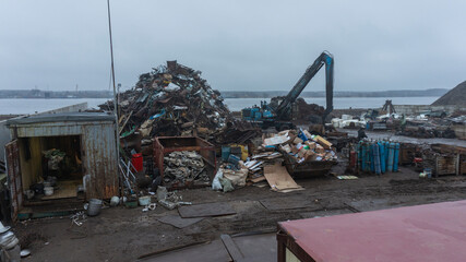 Reception and dispatch port for ferrous metal with loading cranes near the river