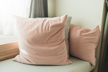 soft cozy pillows on modern sofa background home design concept