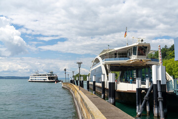 the car and passenger departing from Meersburg harbor towards Konstanz in southern Germany