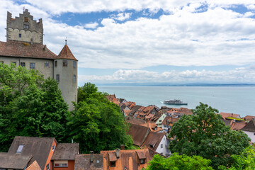 view of Meersburg on Lake Constance with the historic old castle and a passenger boat