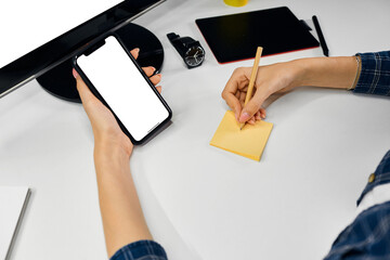 female hands holding a tablet computer