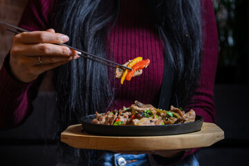 Lunch table with asian meat dishes 