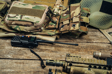 Close up photo of M16 rifle on wooden board