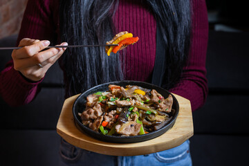 Lunch table with asian meat dishes 