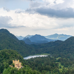 view of the southern Bavarian Alps with the Hohenschwangau Castle and Schwansee
