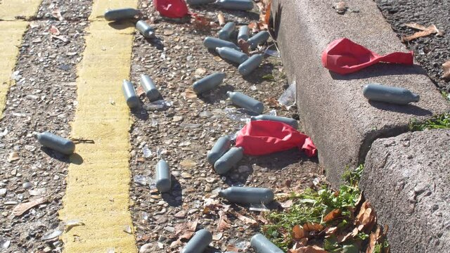 Nitrous Oxide Canisters Balloons On Floor Drugs