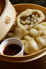 Korean hot pies with meat and sauce on wood table
