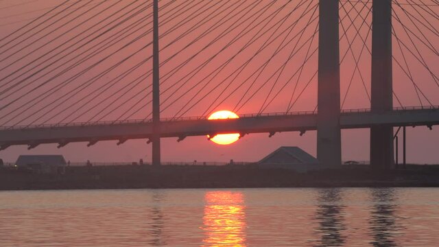Silhouette of Indian River Bridge during sunrise in the summer near Bethany Beach, Delaware, U.S.A