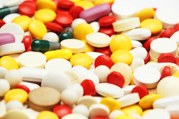 Different colorful tablets at white background
