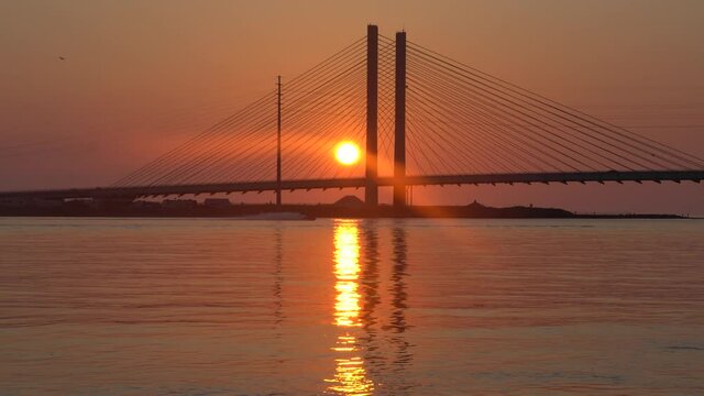 Silhouette of Indian River Bridge during sunrise in the summer near Bethany Beach, Delaware, U.S.A