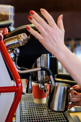 Hand of barista prepared coffee