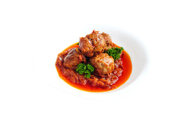 Meatballs with tomato sauce  and vegetables isolated on the white