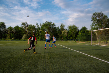 Soccer player kicks the ball.Soccer player takes a corner kick
