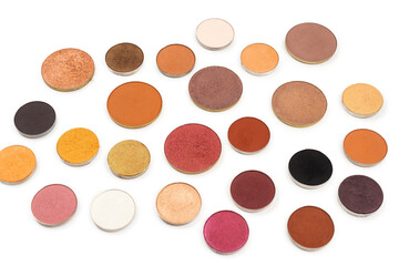 Round multicolored make up eyeshadows isolated on white.